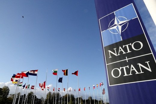 FILE PHOTO: FILE PHOTO: Flags wave outside the Alliance headquarters ahead of a NATO Defence Ministers meeting, in Brussels, Belgium, October 21, 2021. REUTERS/Pascal Rossignol/File Photo/File Photo