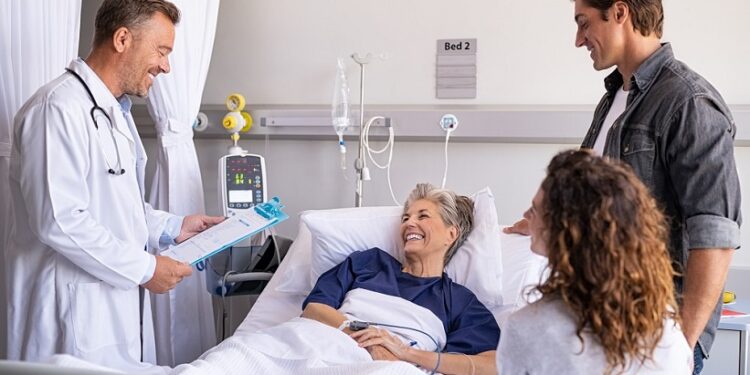 Doctor visiting senior patient with family